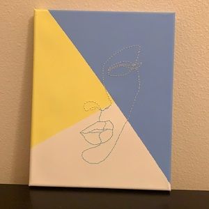 Blue yellow and white picture of a woman's face